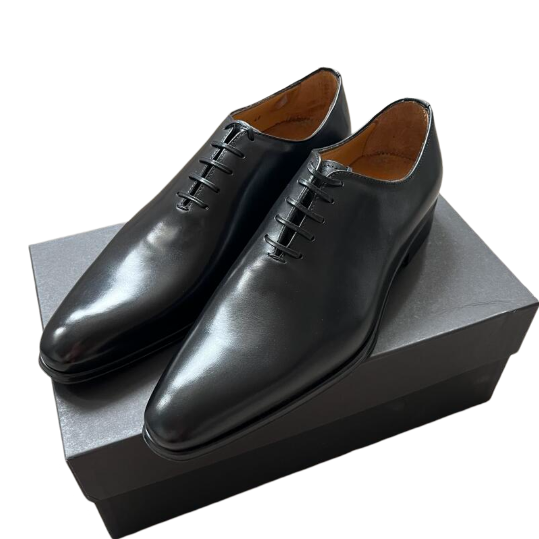 Close-up of black patina leather texture on Benson Wholecut Oxford shoes