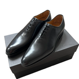 Close-up of black patina leather texture on Benson Wholecut Oxford shoes