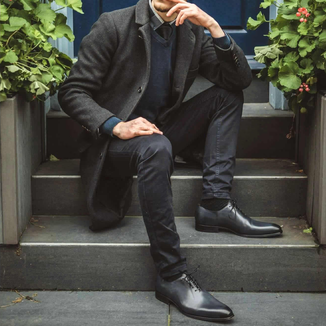 Smooth grey leather wholecut oxford shoes showing fine craftsmanship and finish