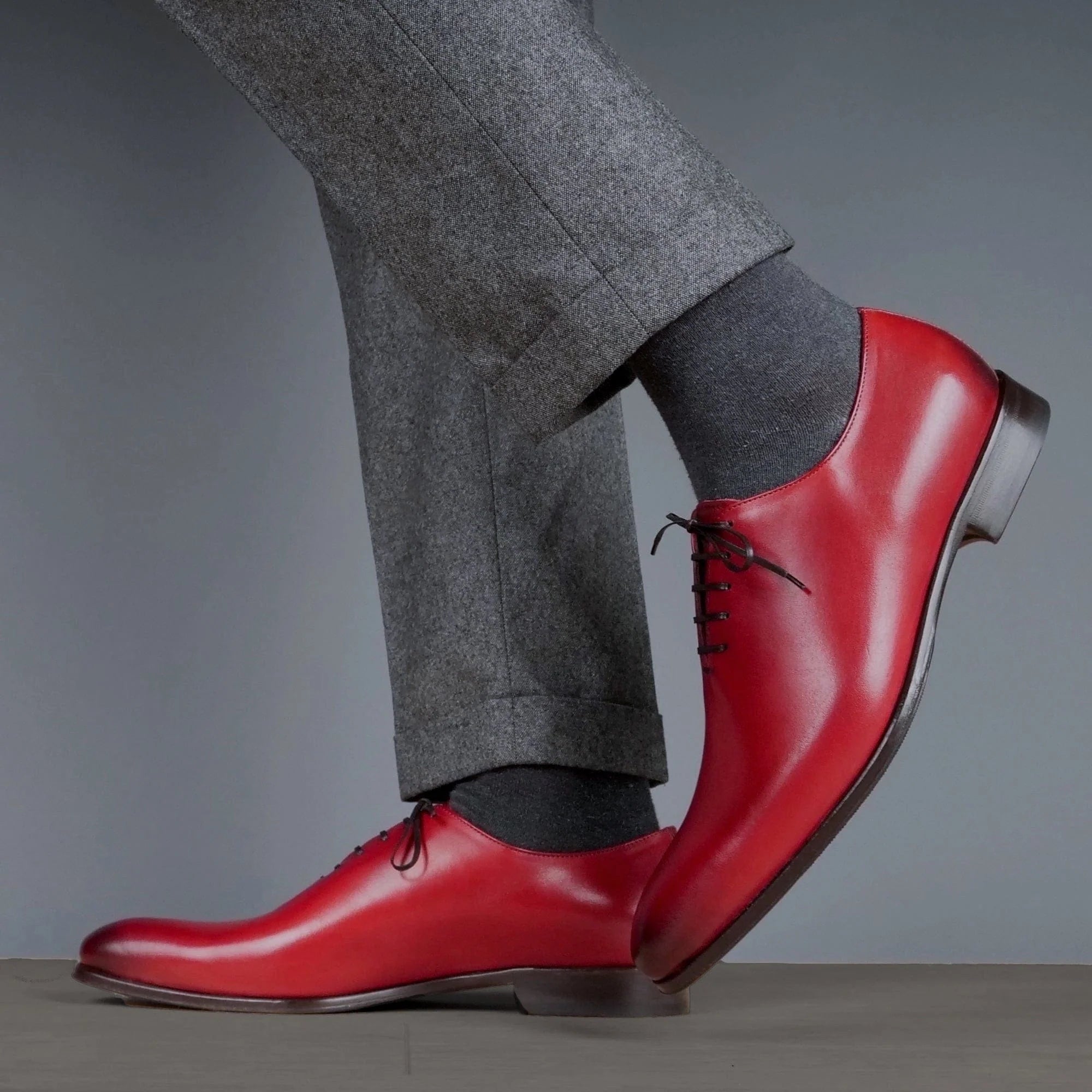 Handcrafted menβs scarlet red leather wholecut Oxford shoes with clean stitching