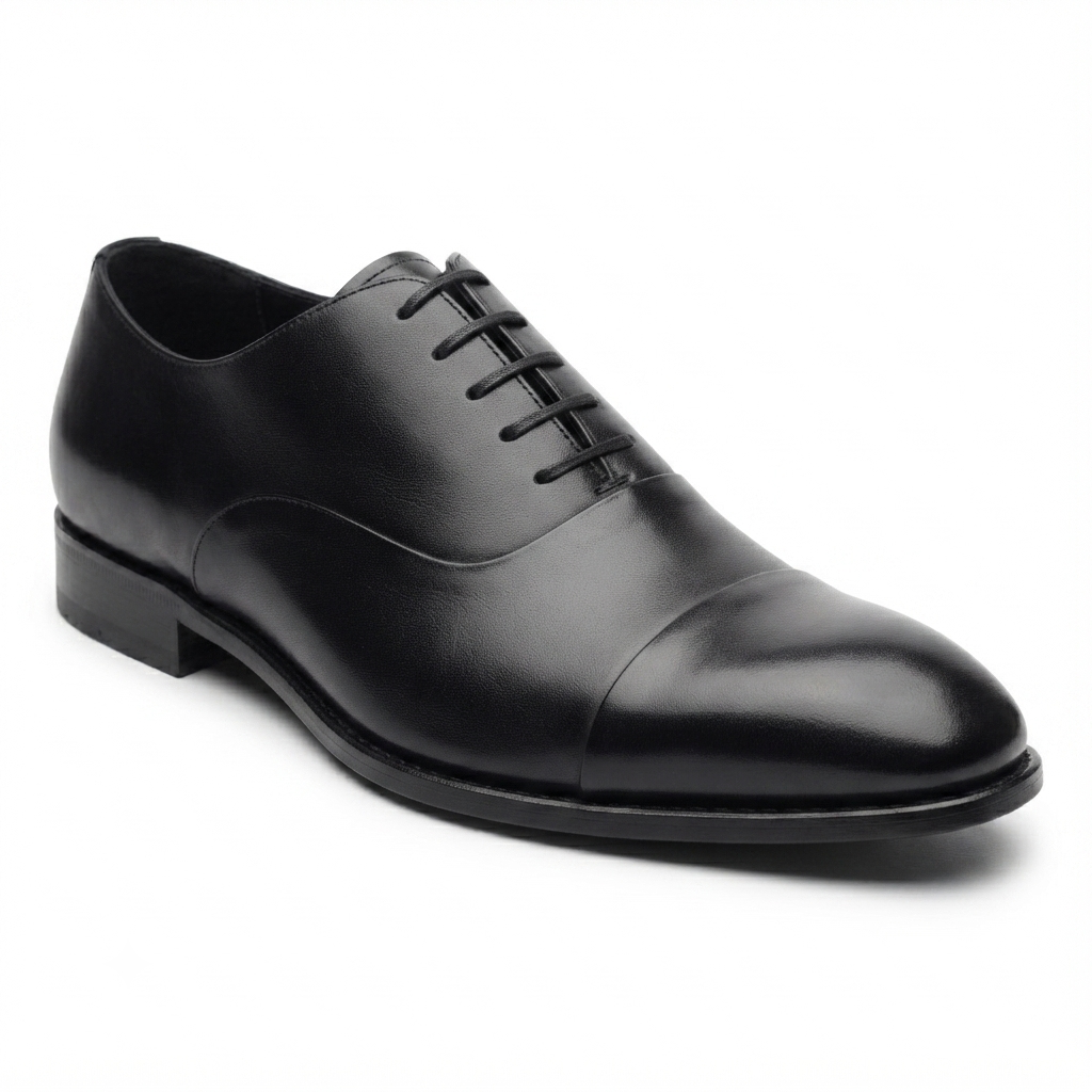 Side view of black leather Oxford dress shoe