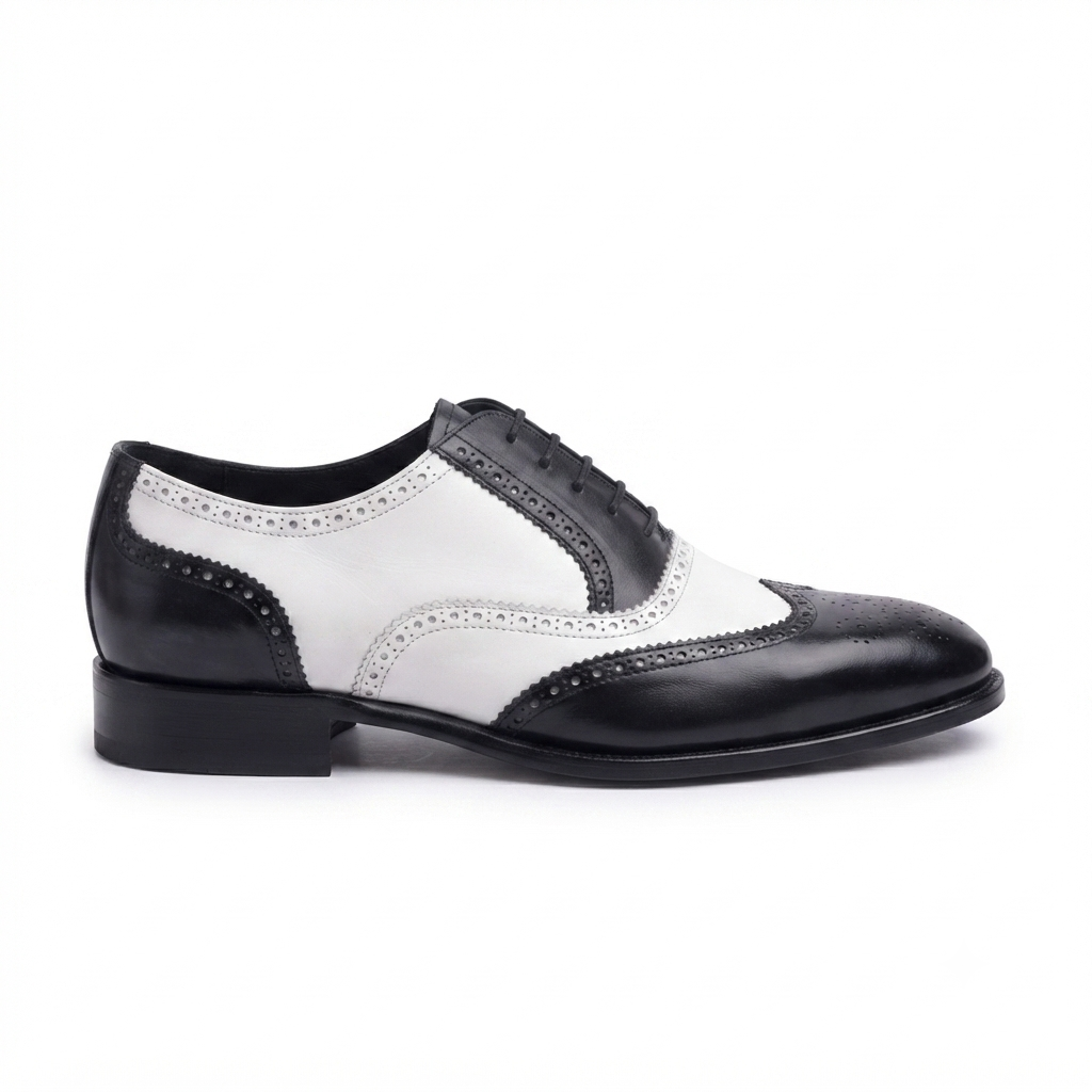 Side view of black and white leather dress brogue shoes