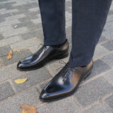 Luxury black wholecut Oxford shoes for men β timeless formal footwear style