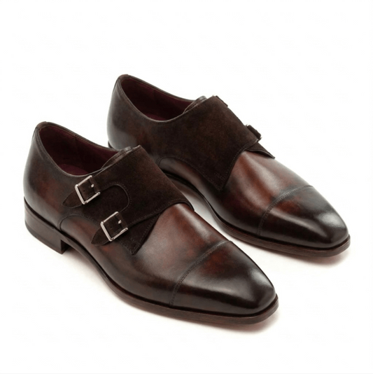 A pair of premium dark brown double monk strap shoes featuring a unique mixed-material design with burnished calf leather and a matching suede panel across the vamp.