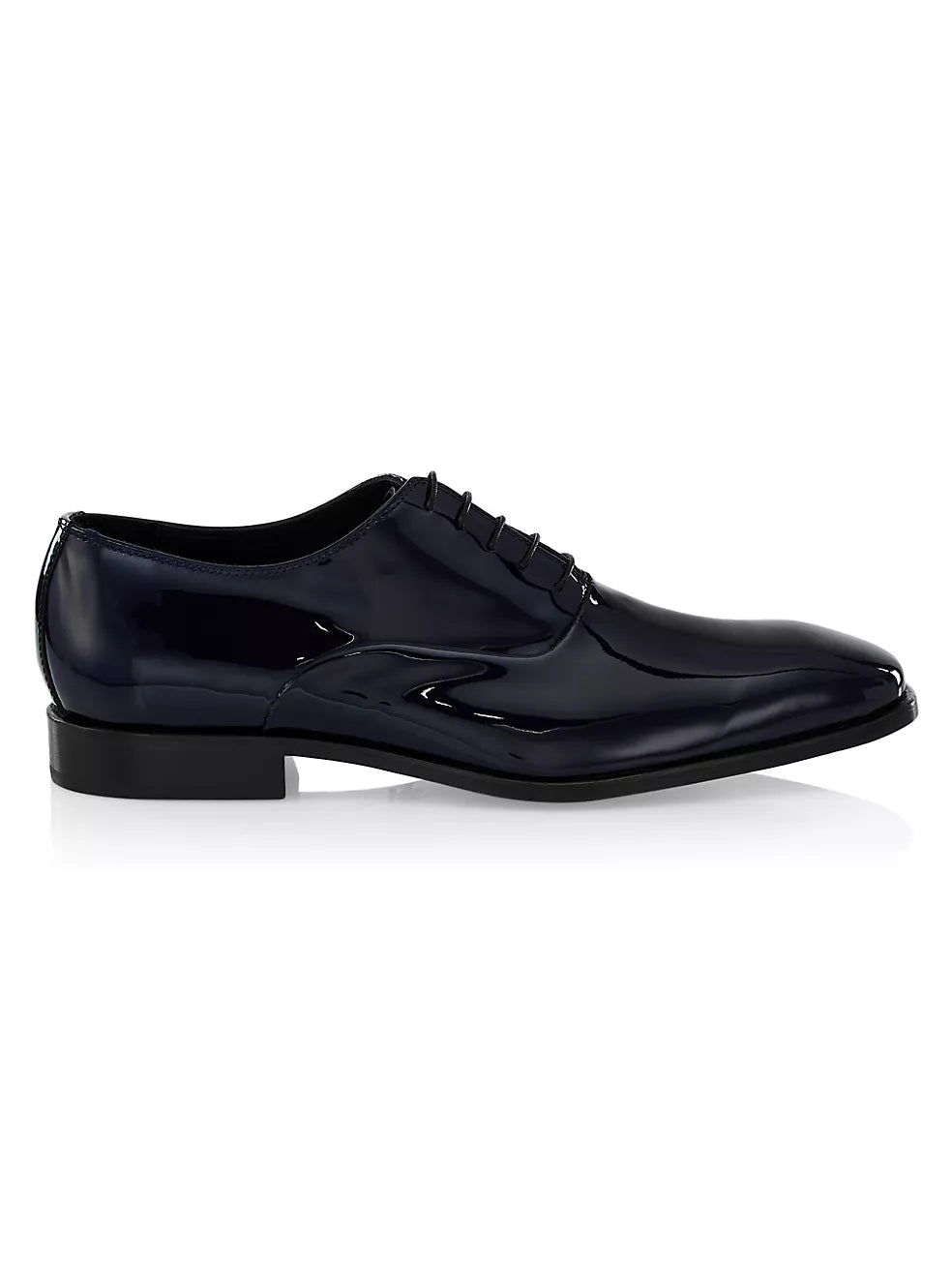 Polished black patent leather dress shoes β detail of shine and craftsmanship