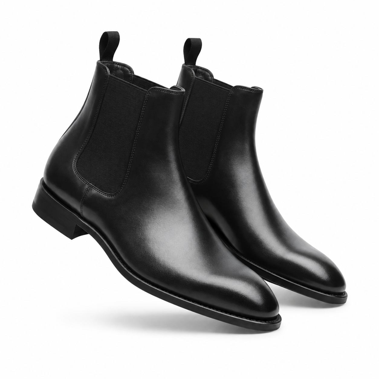 Black leather Chelsea boots pair side profile