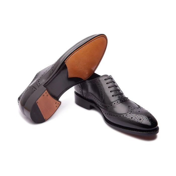 Elegant black formal full brogue Oxfords – angled view