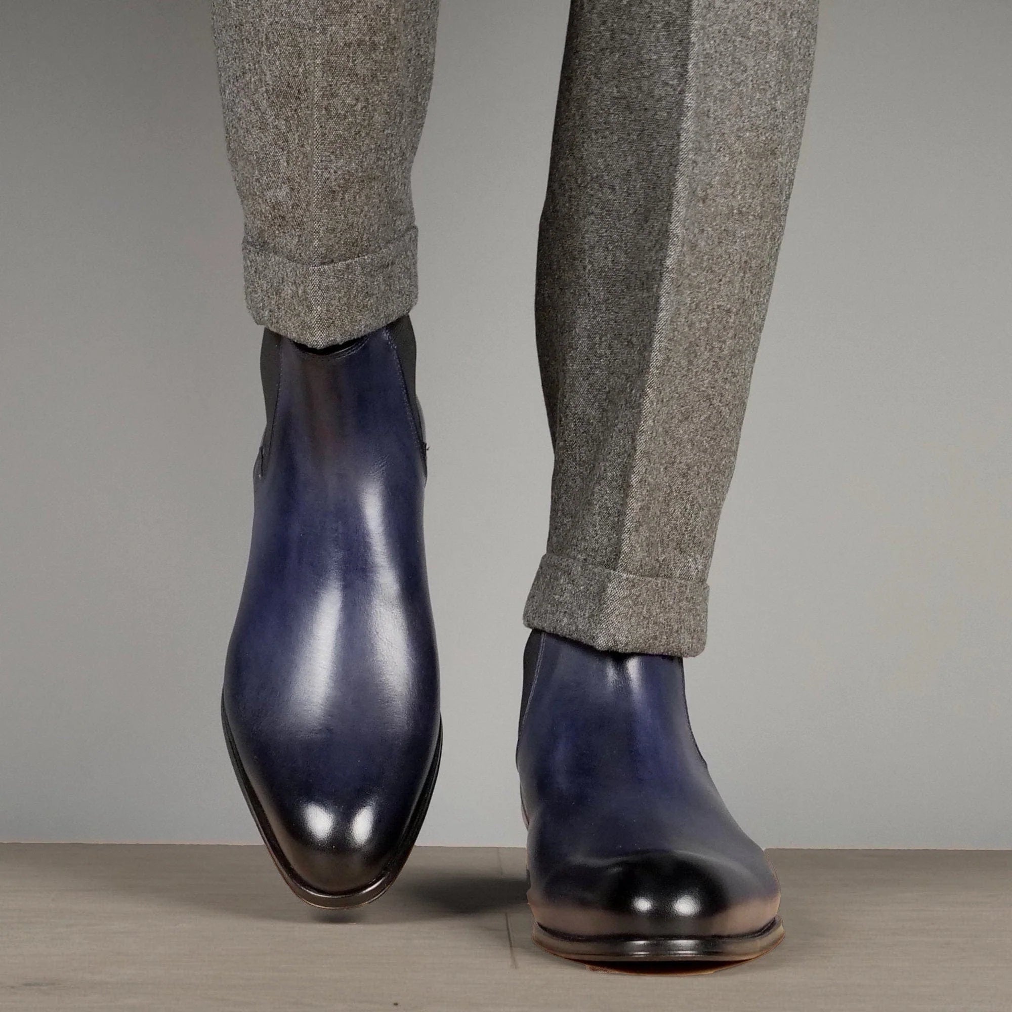 Stylish blue Chelsea boots for men with sleek slip-on ankle boot design