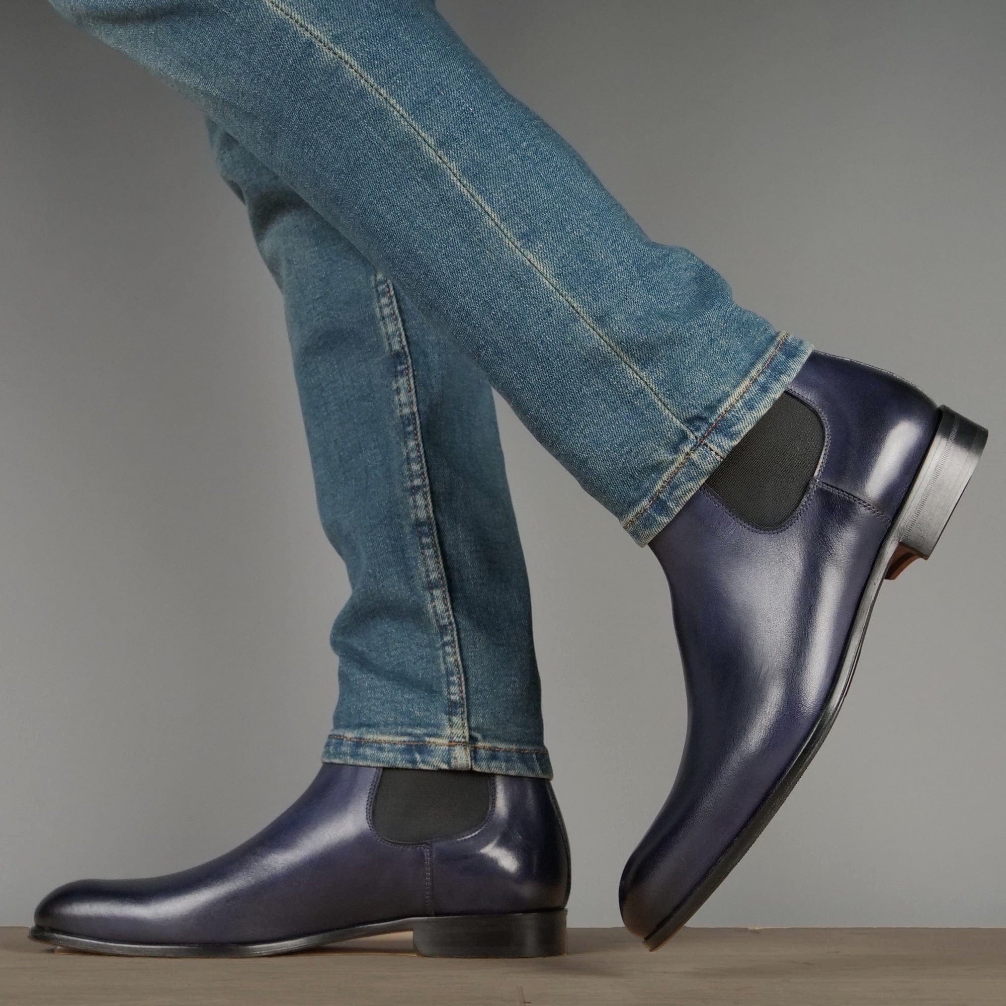 Men’s blue leather Chelsea boots with polished finish and clean silhouette