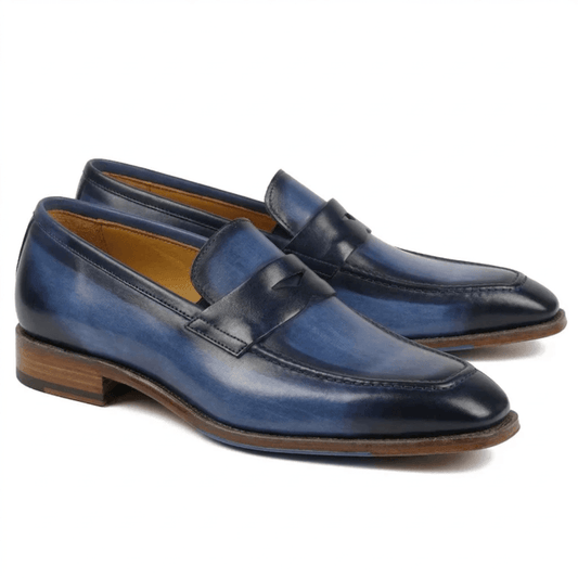 Premium navy blue leather penny loafers for men with a hand-burnished smoky patina and a classic wood-layered heel.