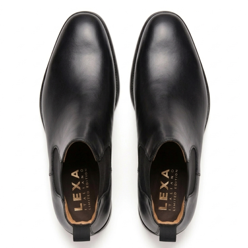 Black leather Chelsea boots pair viewed from above