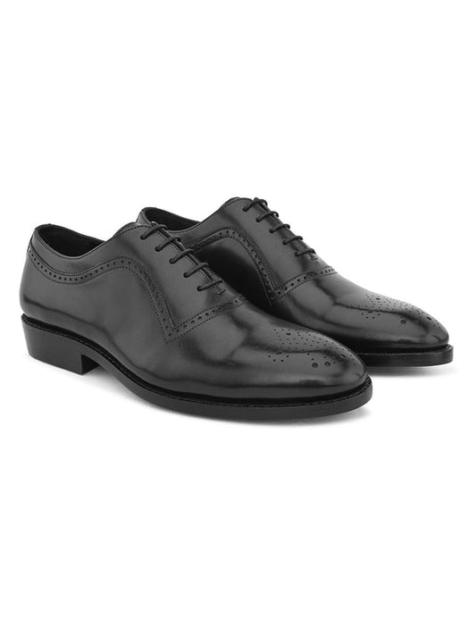 Timeless black leather Goodyear-welted dress shoes with classic formal design