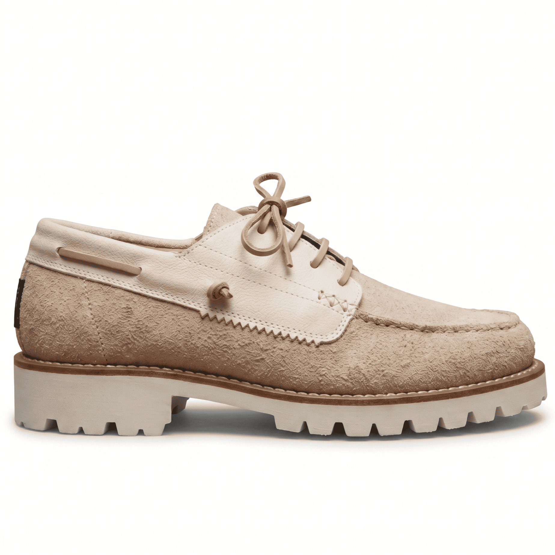 Clean side profile of the beige suede shoe highlighting the hybrid deck-shoe silhouette and chunky midsole.