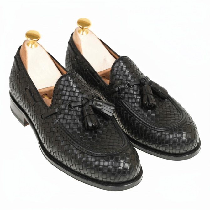 Luxury black woven leather tassel loafers for men with handcrafted braided texture