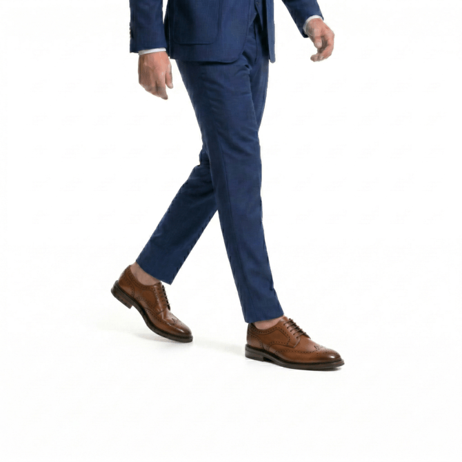 Men styling brown brogue shoes with blue suit walking view