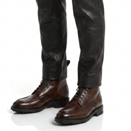 Men wearing brown leather ankle boots styled with casual outfit