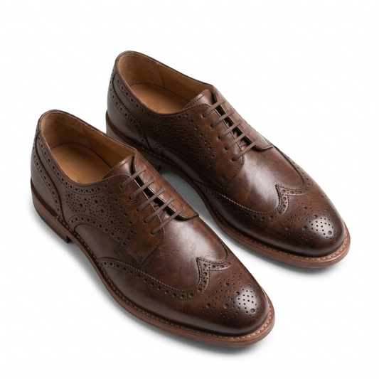Brown leather wingtip Oxford shoes for men with brogue detailing angled view