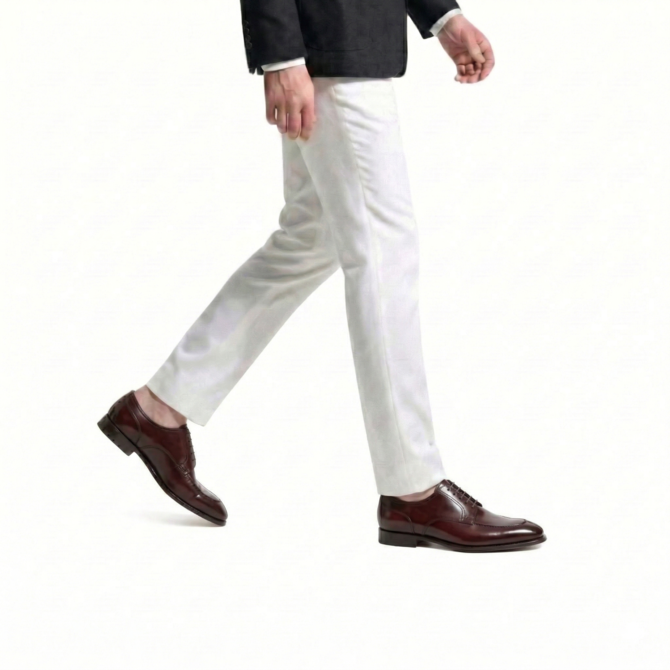 Side walking view of men wearing burgundy Oxford shoes