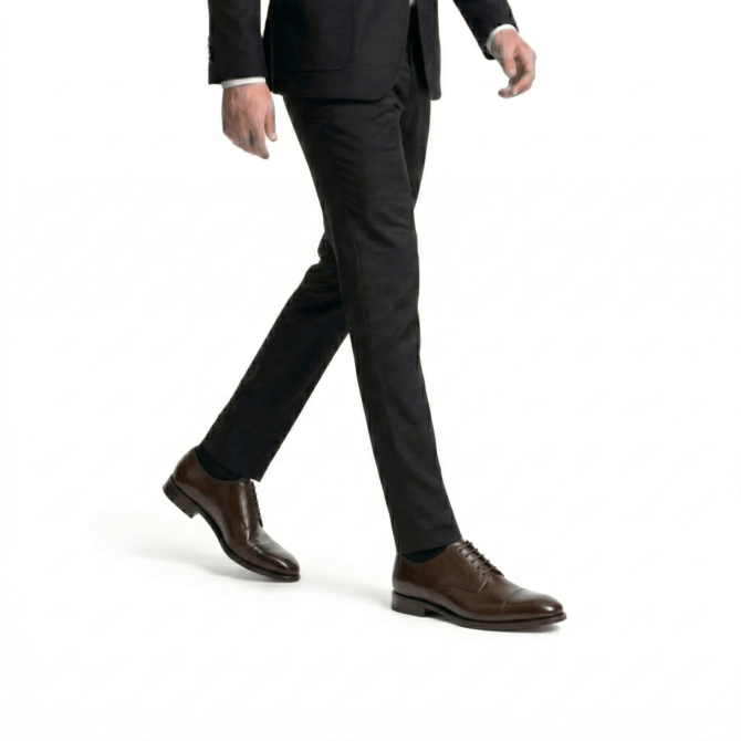 Men styling dark brown Oxford shoes with black formal trousers