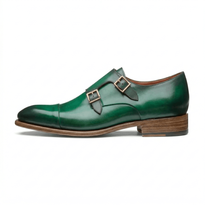 Side angle of green leather monk strap dress shoe with buckle detail