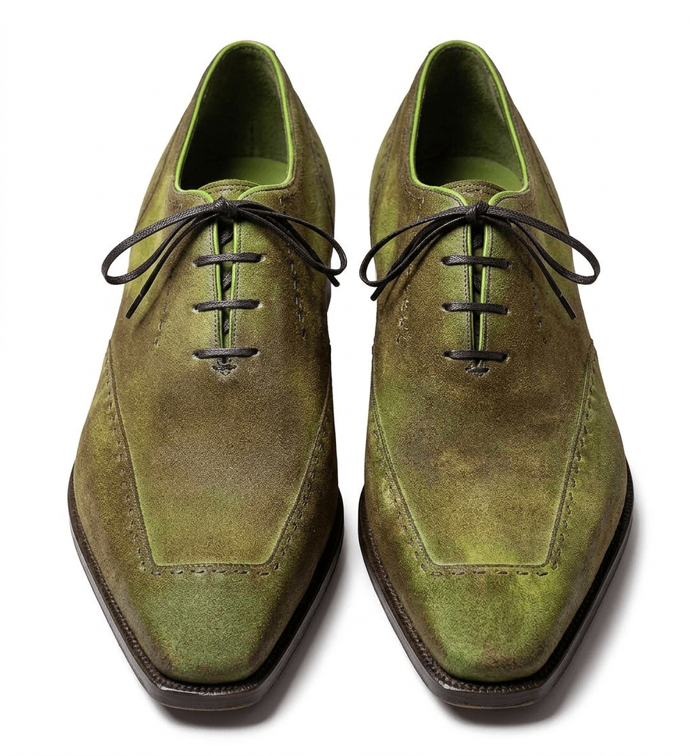 Front-facing pair of olive green dress shoes highlighting the symmetrical design and rich color depth.