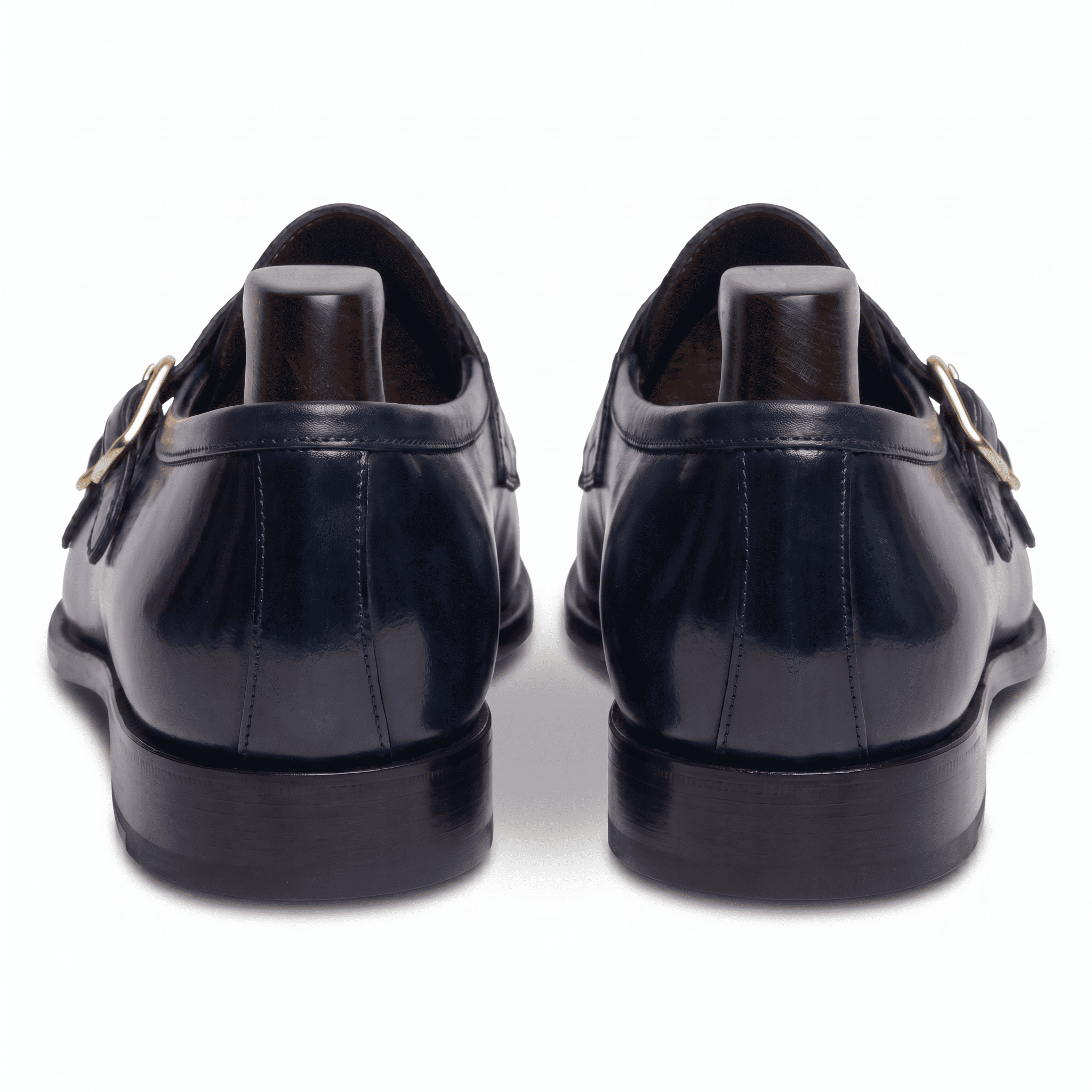 Back view of navy blue double monk strap shoes showing heel and sole