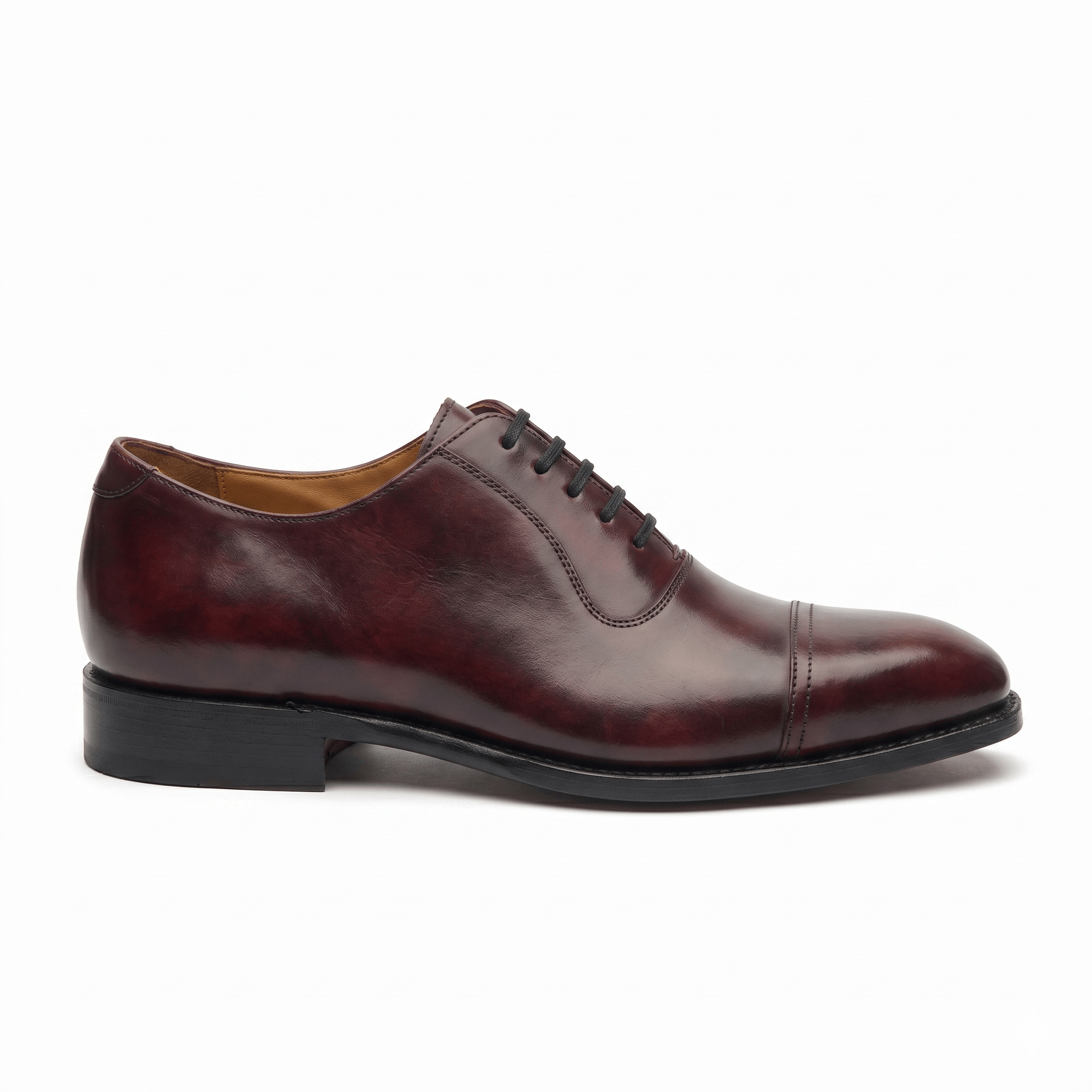 Side profile of a burgundy brown leather Oxford formal shoe