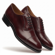 Angled view of burgundy brown leather Oxford shoes for men