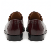 Rear view of burgundy brown leather Oxford shoes showing the heel design