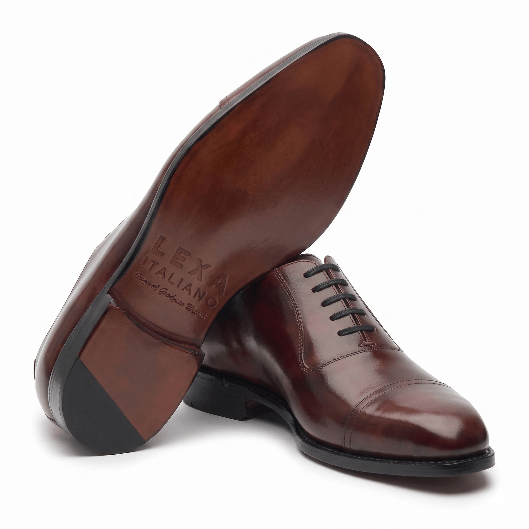 Bottom view of burgundy brown leather Oxford shoes showing the sole design