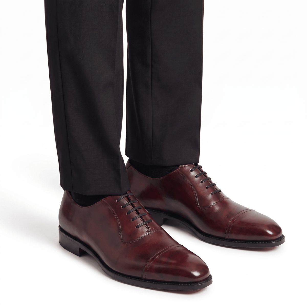 Burgundy brown leather Oxford shoes styled with formal trousers