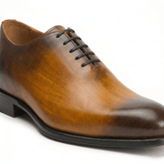Side view of brown leather lace-up dress shoe
