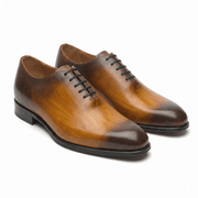Brown leather lace-up dress shoes with handcrafted finish