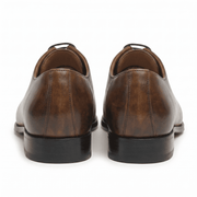 Back view of brown leather lace-up dress shoes