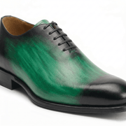 Side view of green leather lace-up dress shoe