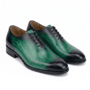 Green leather lace-up dress shoes with handcrafted finish