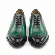 Front view of green leather lace-up dress shoes