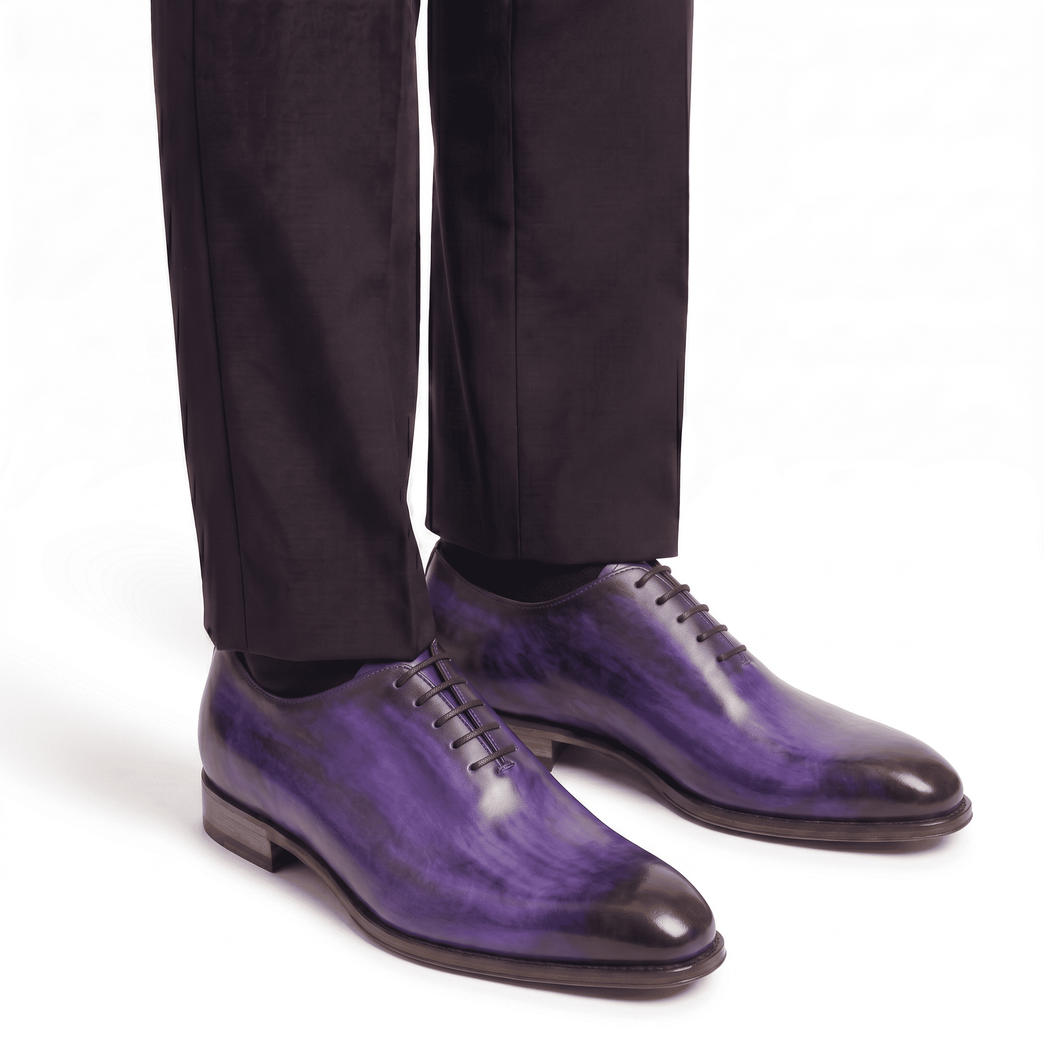 Purple leather dress shoes worn with formal trousers