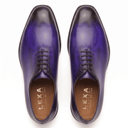 Top view of purple leather lace-up dress shoes