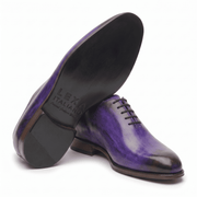 Purple leather dress shoe shown from bottom angle
