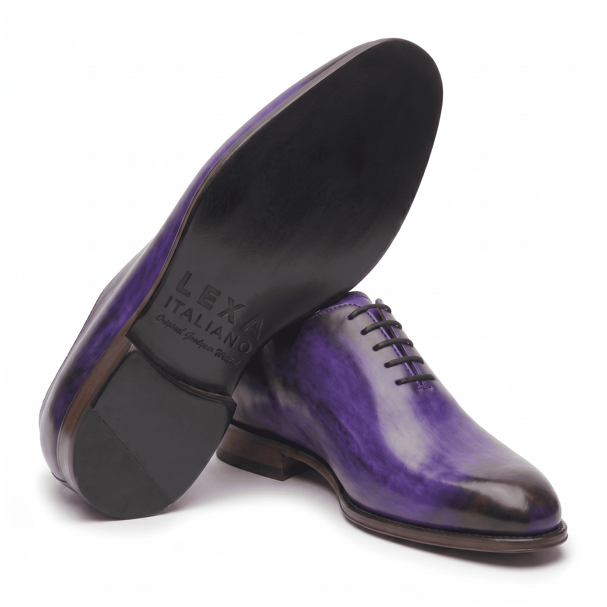 Purple leather dress shoe shown from bottom angle