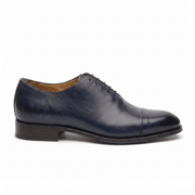 Navy blue leather lace-up dress shoe for men, side profile