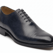 Navy blue leather lace-up dress shoe for men, side angle