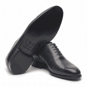 Navy blue leather formal shoe for men, sole and side view
