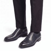 Navy blue leather formal shoes for men worn with trousers