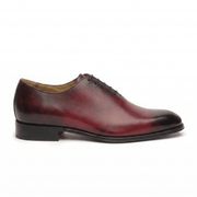 Side profile of burgundy leather lace-up dress shoe