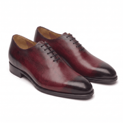 Burgundy leather lace-up dress shoes with handcrafted finish