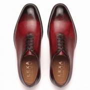 Top view of burgundy leather lace-up dress shoes