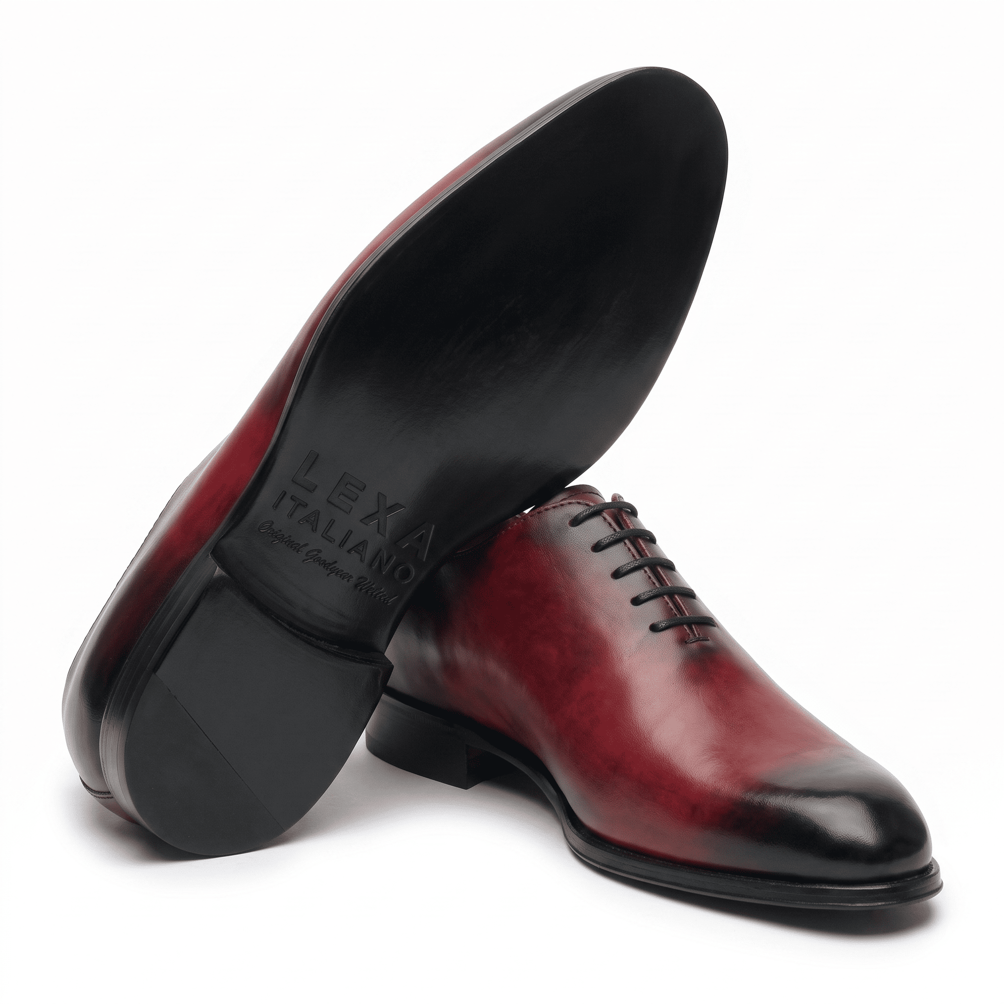 Burgundy leather dress shoe shown from bottom angle