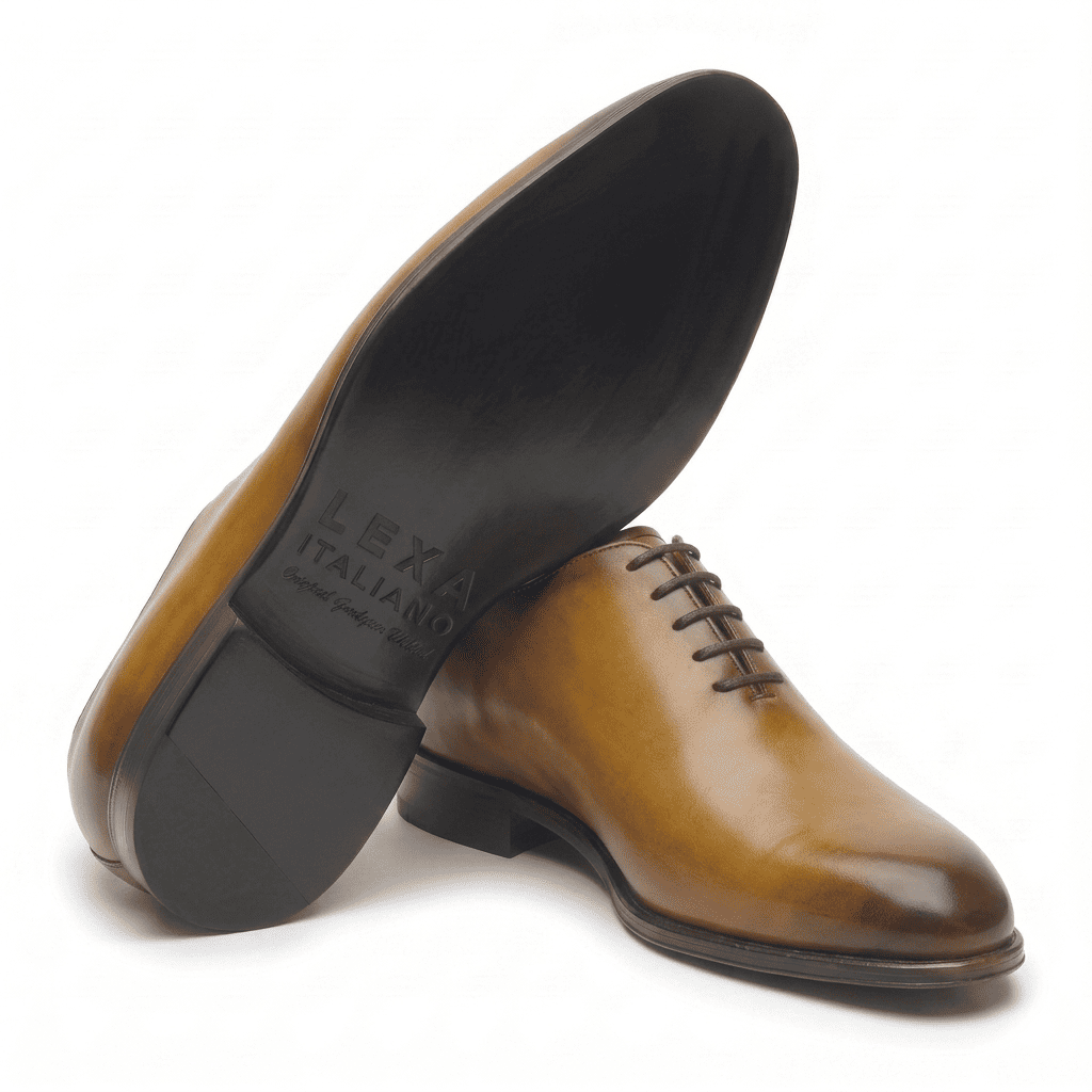 Tan leather dress shoe shown from bottom angle
